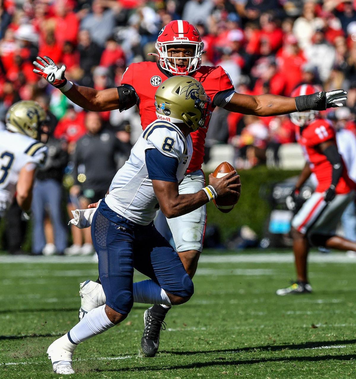 Georgia defender Nakobe Dean chases down Charleston Southern quarterback Jack Chambers as the Bulldogs cruised to a 56-7 victory.