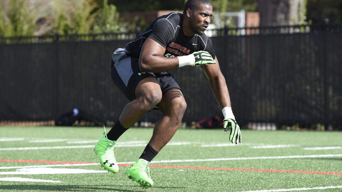 DAVID BARNES/UNIVERSITY OF GEORGIAFormer Georgia linebacker Jordan Jenkins completes a drill for NFL scouts during Georgia's Pro Day at Butts-Mehre Heritage Hall on Wednesday.