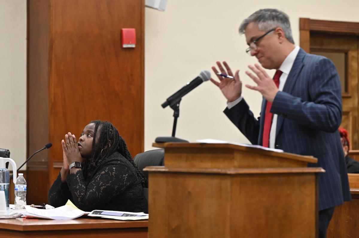 Lateesha Riddle (left) listens to closing arguments made by her attorney Reza Sedghi at the Bibb County Courthouse on Monday, Jan. 27, 2025, in Macon, Georgia. Macon Judicial Circuit Judge Jeffery Monroe denied Riddle’s motion for immunity from prosecution on Monday after hearing multiple testimonies in a 2022 case where Riddle fatally shot her husband, while Riddle said she acted in self-dense. The case will now go to a jury trial.