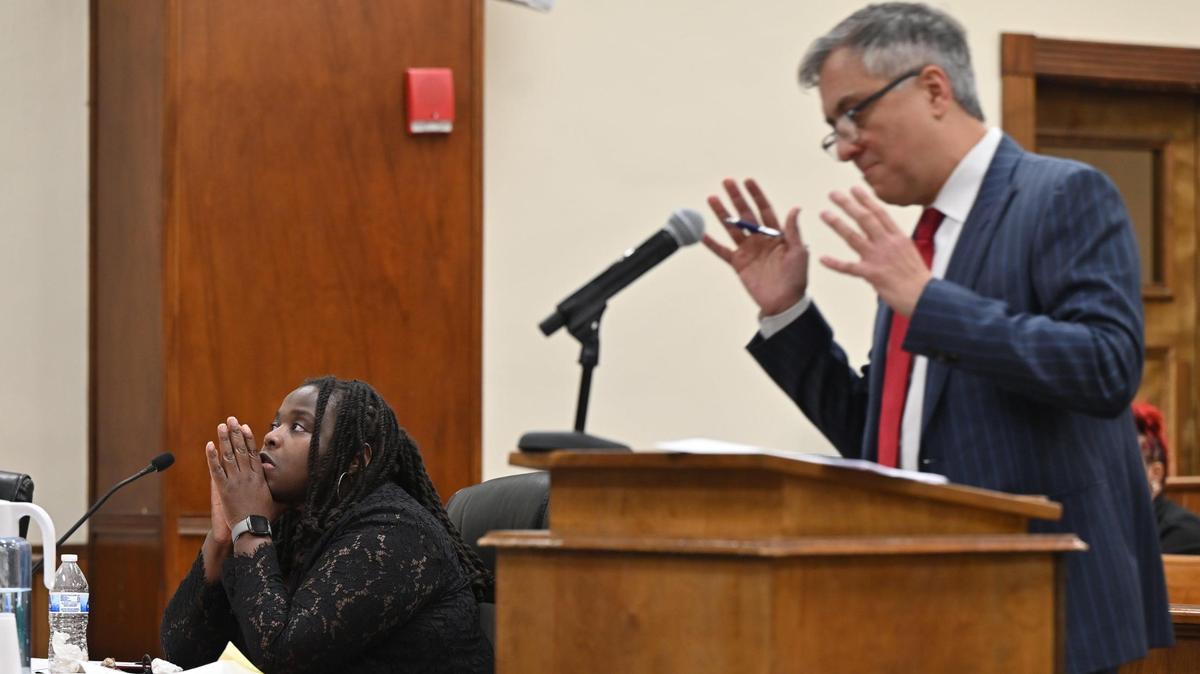 Lateesha Riddle (left) listens to closing arguments made by her attorney Reza Sedghi at the Bibb County Courthouse on Monday, Jan. 27, 2025 in Macon, Georgia. Macon Judicial Circuit Judge Jeffery Monroe denied Riddle’s motion for immunity from prosecution on Monday after hearing multiple testimonies in a 2022 case where Riddle fatally shot her husband, while Riddle said she acted in self-dense. The case will now go to a jury trial.