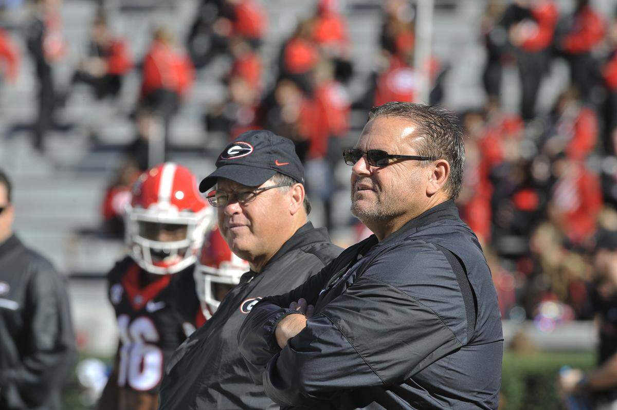 New Arkansas Coach Sam Pittman, right, must face league powers Alabama, Auburn, Florida, Georgia, LSU and Texas A&M in his first season.