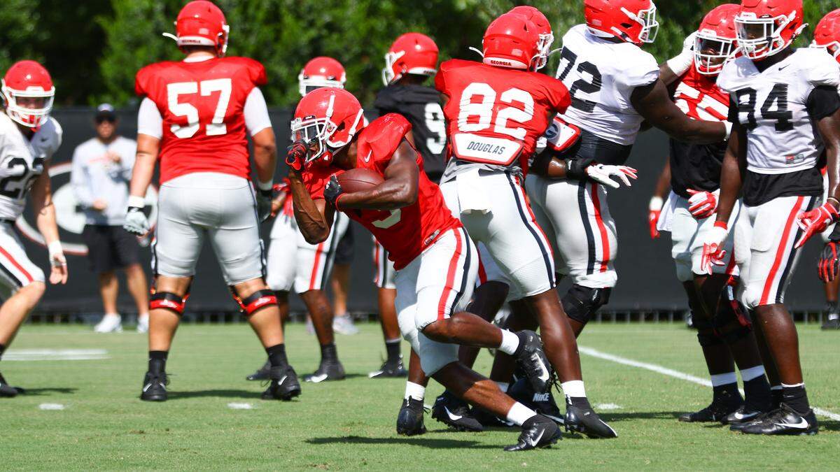 Georgia tailback Zamir White (3) runs the ball during the Bulldogs’ session on the Woodruff Practice Fields in Athens, Ga., on Wednesday, Aug. 21, 2019.