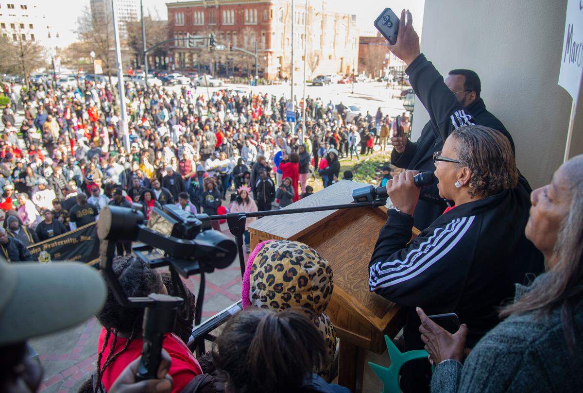 JASON VORHEES/THE TELEGRAPH Macon, GA, 01/20/2020: Lisa Watson, program coordinator for the Macon-Bibb MLK Commission, speaks to marchers Monday out front of the Macon-Bibb Government Center during the annual MLK Memorial March. Marchers started from the Rosa Jackson Center, Booker T. Washington Center, Frank Johnson Center and Memorial Gym.