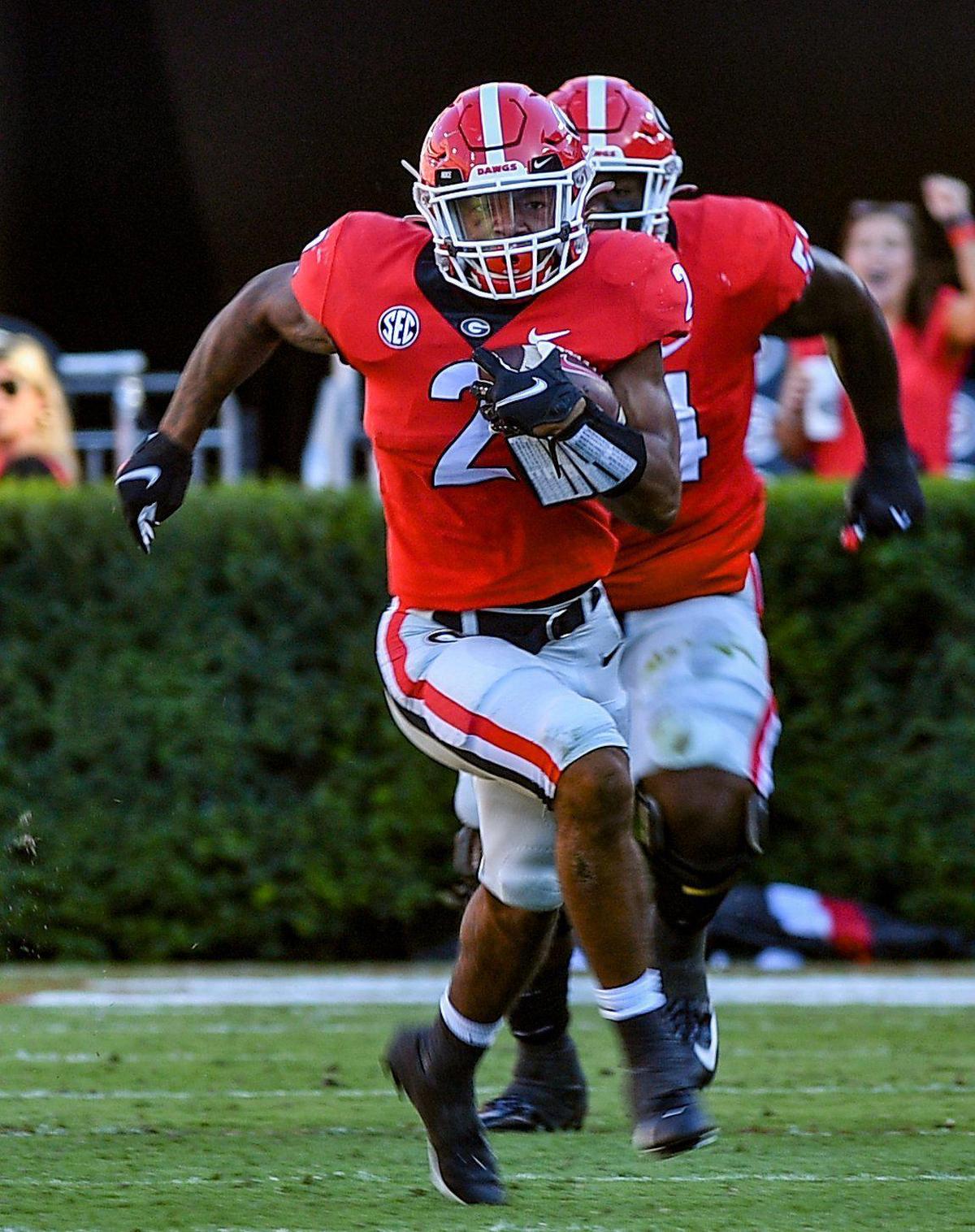 DONN RODENROTH,Athens, Georgia, 10/16/2021: Georgia running back Kendall Milton busts out the backfield for a first down Saturday against Kentucky.