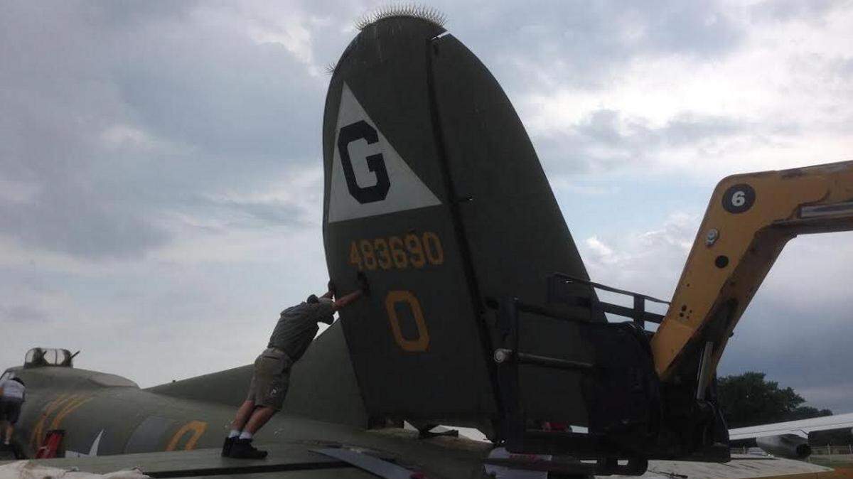 Crew members of All Coast Aircraft Recovery disassemble a B-17 bomber at Grissom Air Museum in Peru, Indiana. The plane is expected to arrive at the Museum of Aviation at about noon Friday if there are no delays.