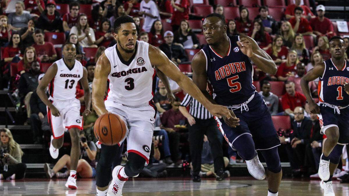 Georgia's Juwan Parker (3) and Auburn's Mustapha Heron (5) go at it during last year's meeting at Stegeman Coliseum.