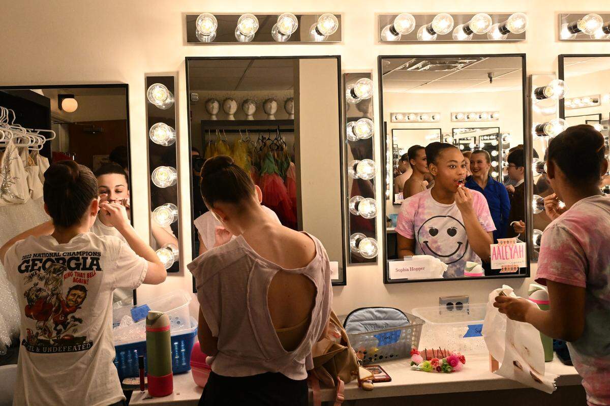 Aeleyah Hubbard (right) gets ready for dress rehearsal with other Nutcracker of Middle Georgia dancers on Tuesday, Dec. 9, 2025, at the Grand Opera House in Macon. 