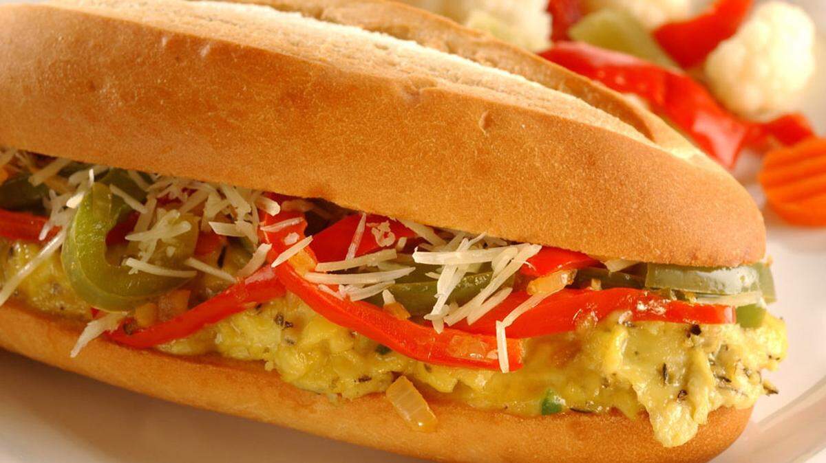 Sauteed red and green bell peppers get a boost of heat from jalepeno in this variation on a classic Lenten sandwich.