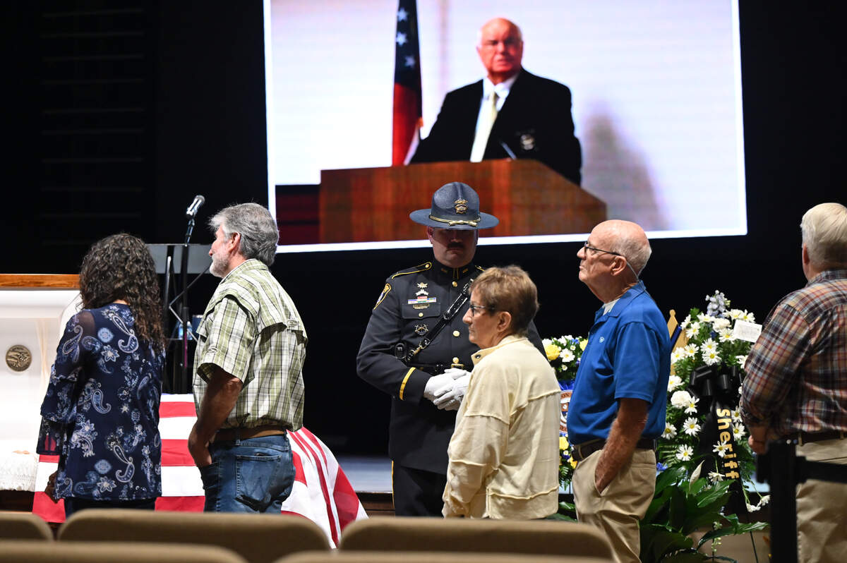 Community members line up near the casket of the late Houston County Sheriff Cullen Talton, the nation’s longest serving sheriff, at the visitation at Southside Baptist Church on Tuesday, Oct. 22, 2024 in Warner Robins, Georgia.