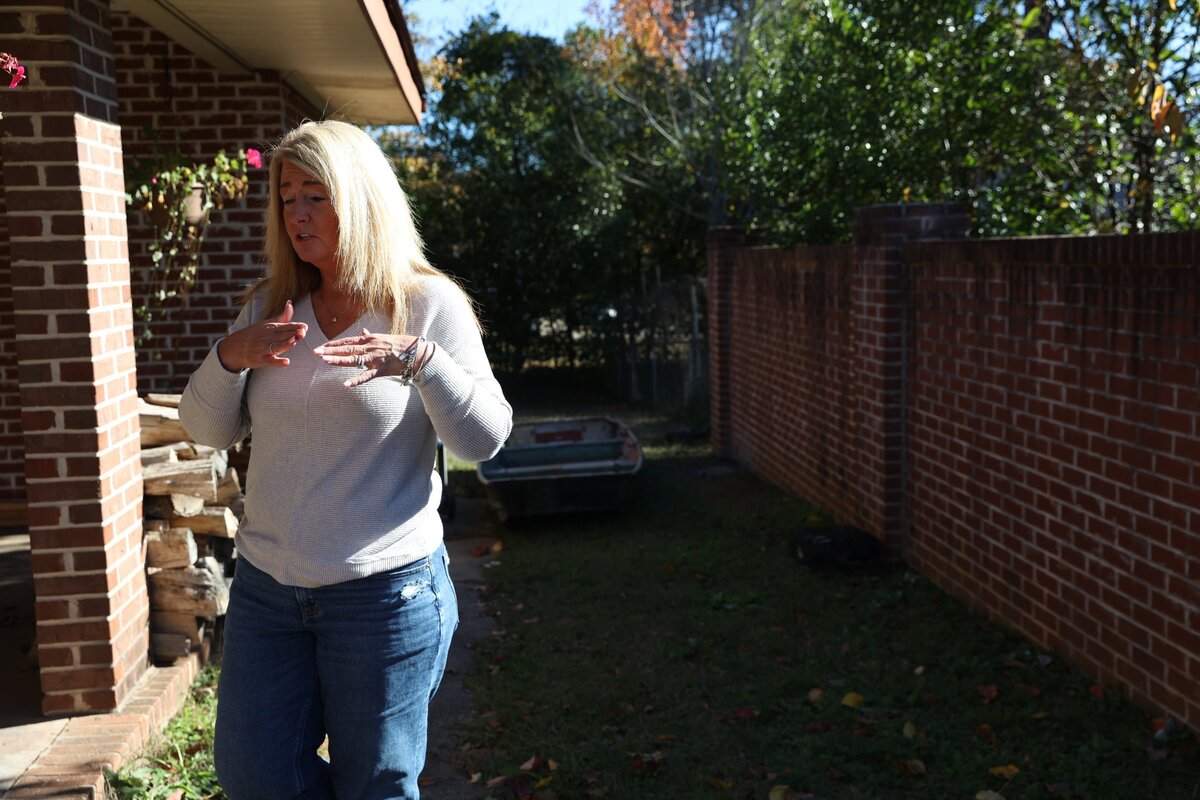 Helen Jones, of Warner Robins, who rents the house next to the condemned property on Angus Boulevard, speaks on how she has been impacted by the property’s rat infestation while standing in her side yard on on Thursday, Dec. 12, 2024, in Warner Robins, Georgia. Jones said that the stress of dealing with the rats that are coming from next door has “ruined her Christmas” and she is making plans to move out of the house.