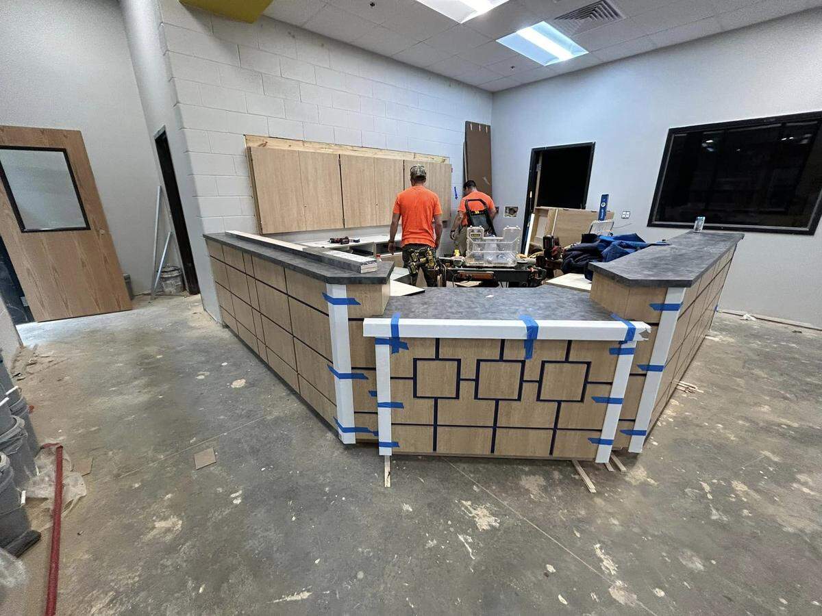 Workers from ICB Construction Group work on the front office of the new Springdale Elementary, which is set to open at the beginning of the 2024-2025 school year.