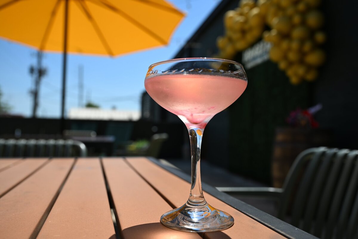 A “Birthday Suit” vodka cocktail from Longleaf Distillery Co. sits on a table outside of the distillery on Saturday, April 19, 2025, in Macon, Georgia. Longleaf Distillery Co. committed to planting one longleaf pine tree for every “Birthday Suit” signature cocktail sold on Saturday, on top of their commitment to plant a tree for every bottle of spirits sold.