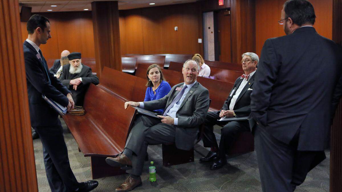 State Rep. Allen Peake, R-Macon, center, waits for committee members to arrive for a Medical Cannabis Working Group meeting, Tuesday, Feb. 13, 2018, at the state Capitol office building in Atlanta.