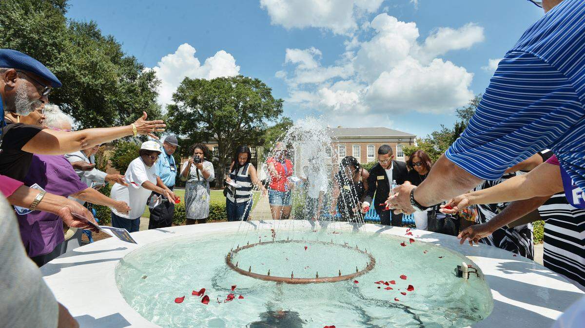 Rose petals were thrown into the fountain at the Fort Valley State University quadrangle Saturday in memory of the late Julian Bond.
