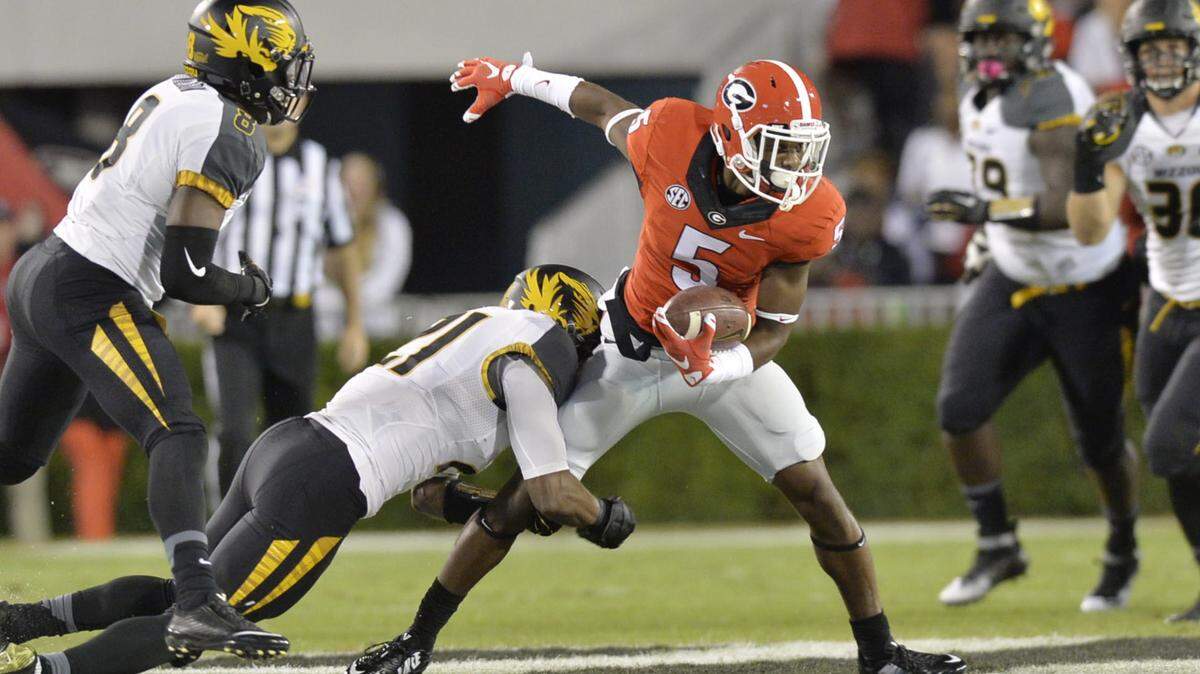 BEAU CABELL/THE TELEGRAPH 
 Athens, Ga., 10/17/2015: The Mizzou defense close in on Georgia running back Terry Godwin (5).