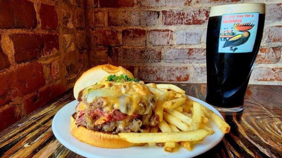 A popular spot in downtown Macon, GA, Bearfoot Tavern, aims to come back better than ever after a catastrophic roof collapse caused its temporary closure. The pub’s stuffed Reuben burger (pictured above) is an 8 ounce certified Angus beef patty filled with corned beef and Swiss cheese topped with sauerkraut and thousand island dressing.