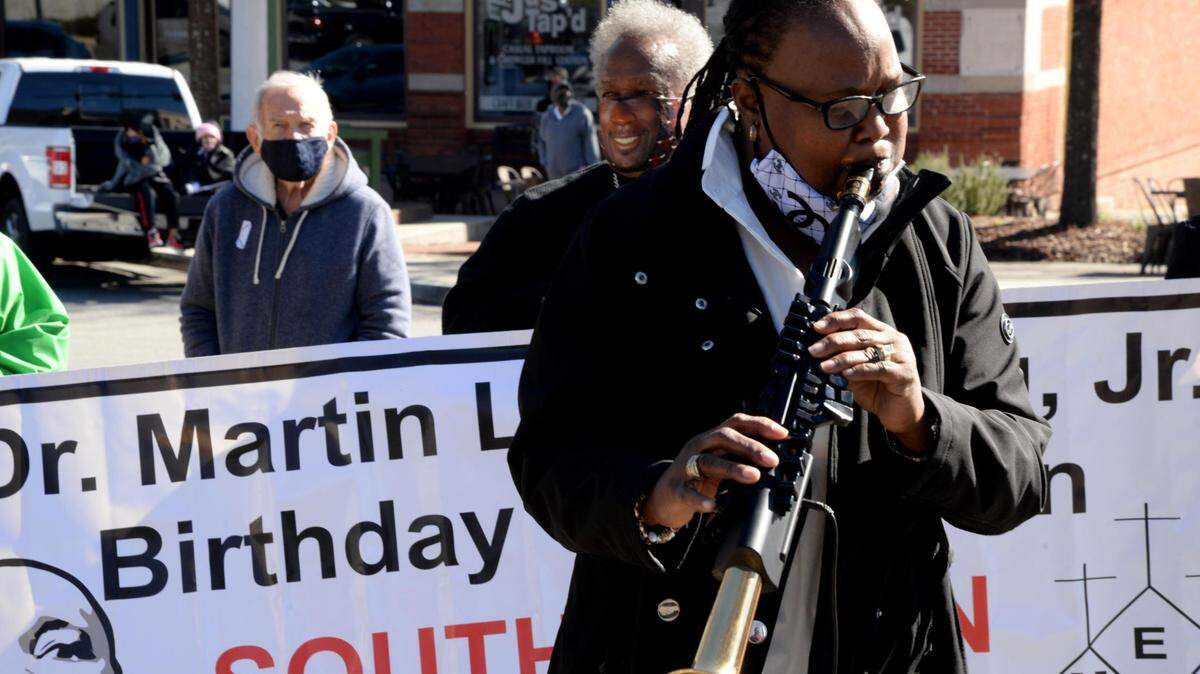 Tracie Washington-Scott plays the flute at the Martin Luther King Jr. Day ceremony in Rosa Parks Square last year. This year’s event is scheduled to begin at 10 a.m.