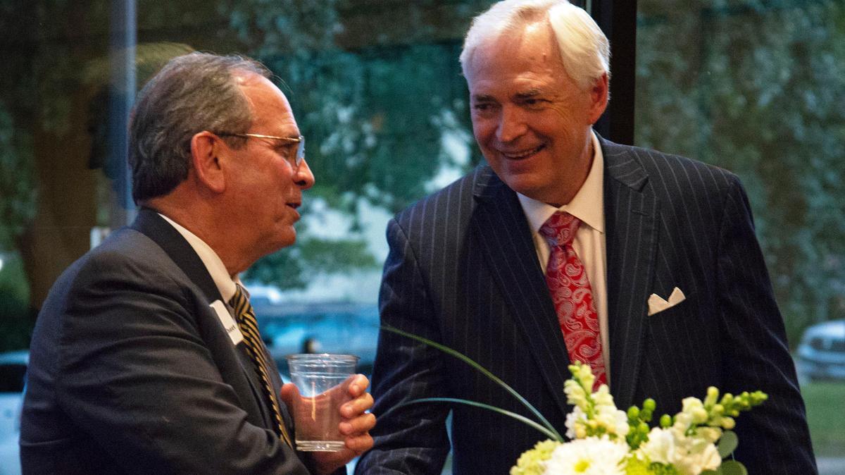 Macon-Bibb Mayor Robert Reichert and Mercer University President Bill Underwood, left to right, shook hands on Oct. 15, 2018, at the Grand Opera House at the reveal of the opera house’s new renovations. Underwood recently was listed on Georgia Trend’s 100 Most Influential Georgians of 2019.