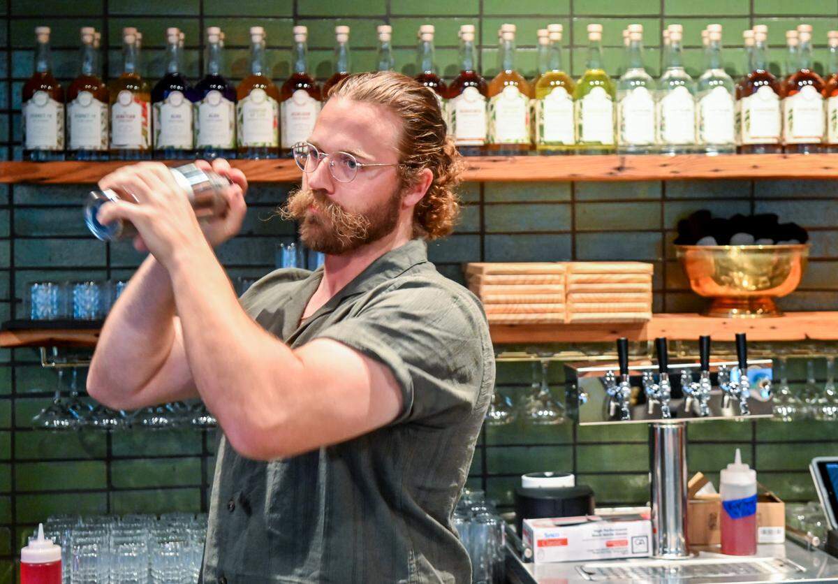 Hunter Hawkins makes a Cafe Romano house cocktail at Longleaf Distillery at 664 Second St. in downtown Macon.