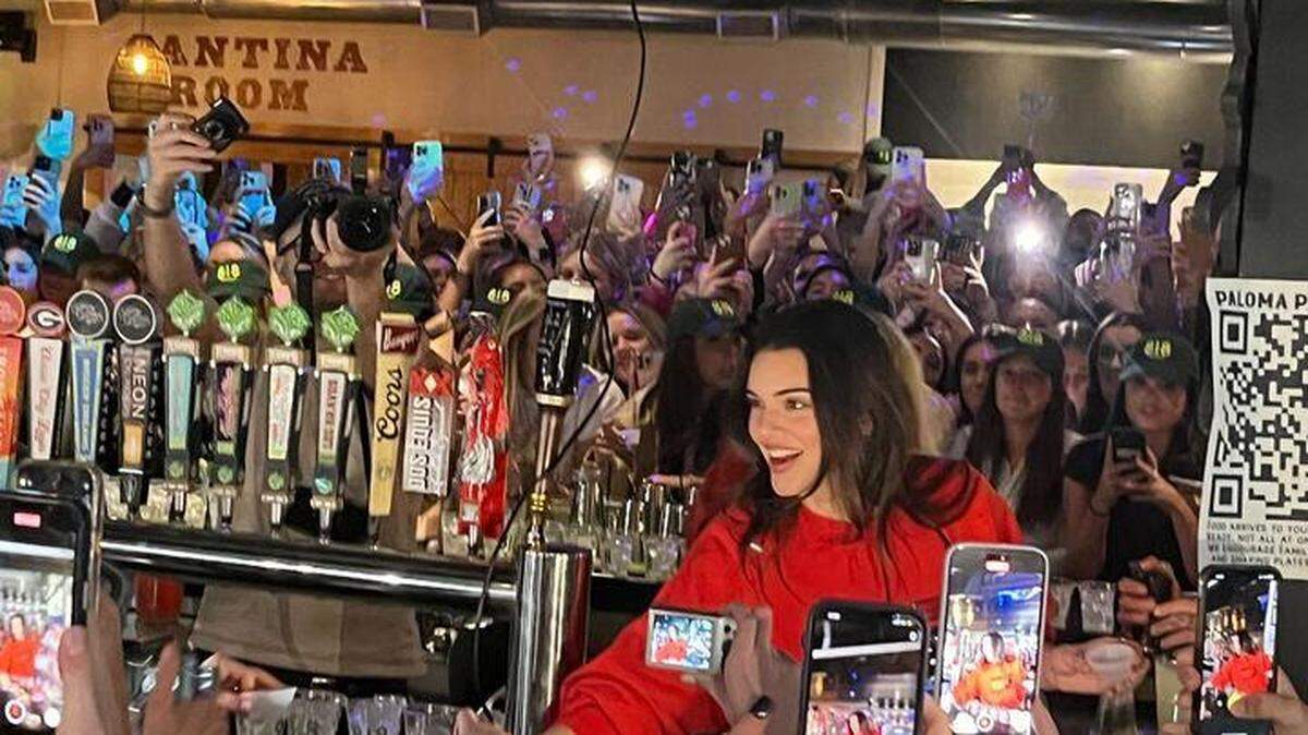 Kendall Jenner spotted serving shots to fans at Georgia bar.