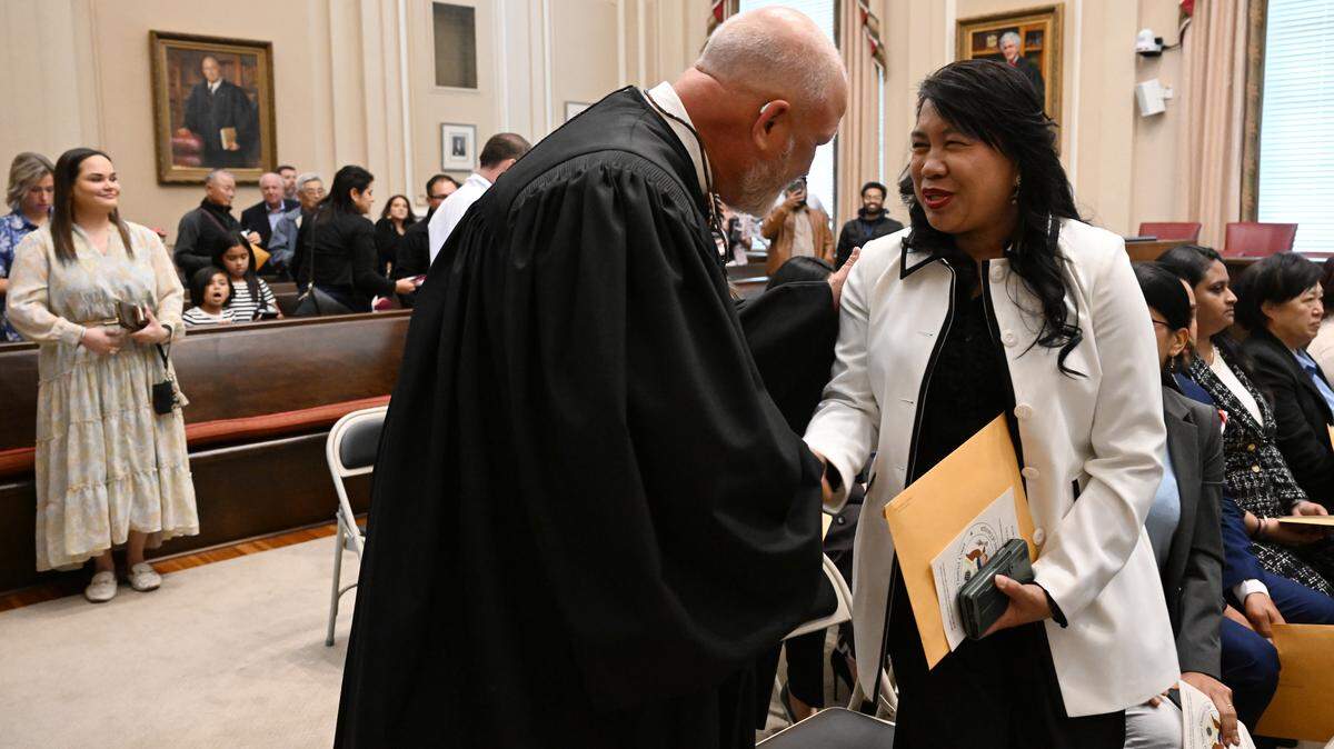Kenneth Beran Masud, of Royston, Ga., (right) shakes hands with Judge Tilman E. Self III after becoming a naturalized United States citizen on Wednesday, April 8, 2026, at the Bootle Federal Courthouse in Macon.