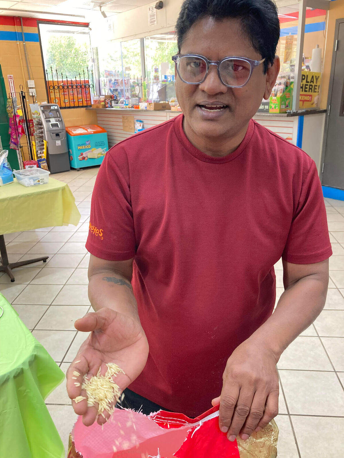 Alex Johnson, owner of Alex Indian Food & Fast Food convenience store, talks about how he uses extra long basmati rice for authentic Indian dishes served at his store in Centerville.