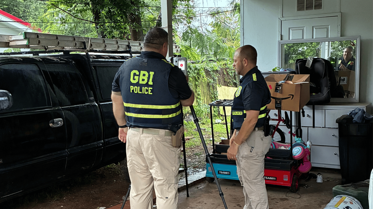 Two Georgia Bureau of Investigation agents examined a crime scene at a home on the 100 block of Louis Street in Warner Robins, Ga. A Warner Robins Police Department officer shot a suspect who was allegedly involved in a domestic dispute at the location on Sunday, Aug. 3, 2025.