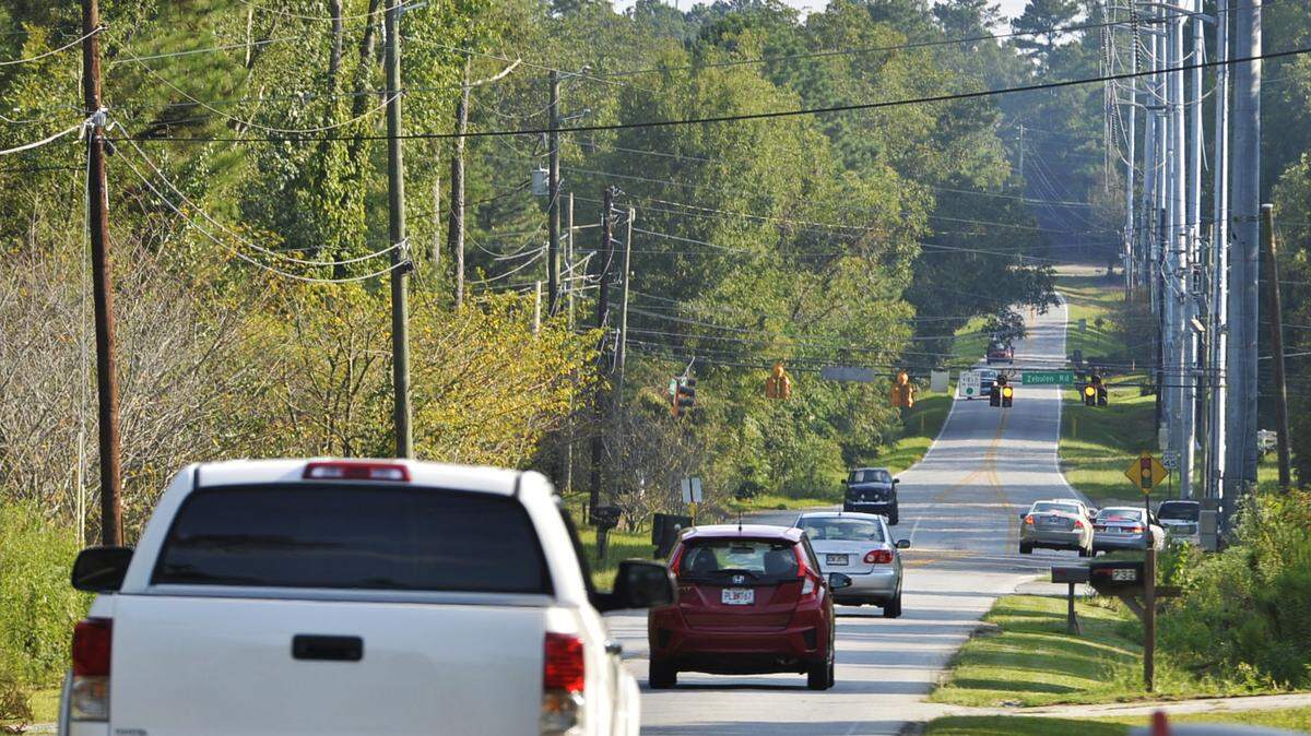 Traffic moves Friday along Bass Road as it approaches the intersection of Zebulon and Foster roads in Macon.