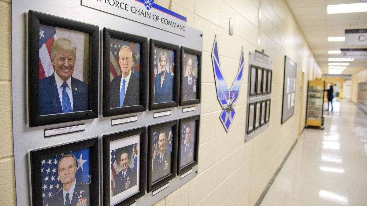 The Howard High School JROTC Air Force Chain of Command display. After students kept on vandalizing the paper nameplate for President Trump, the instructor got tired of it and put a note below the photo that said "whether you like it or not." The note has since been removed.