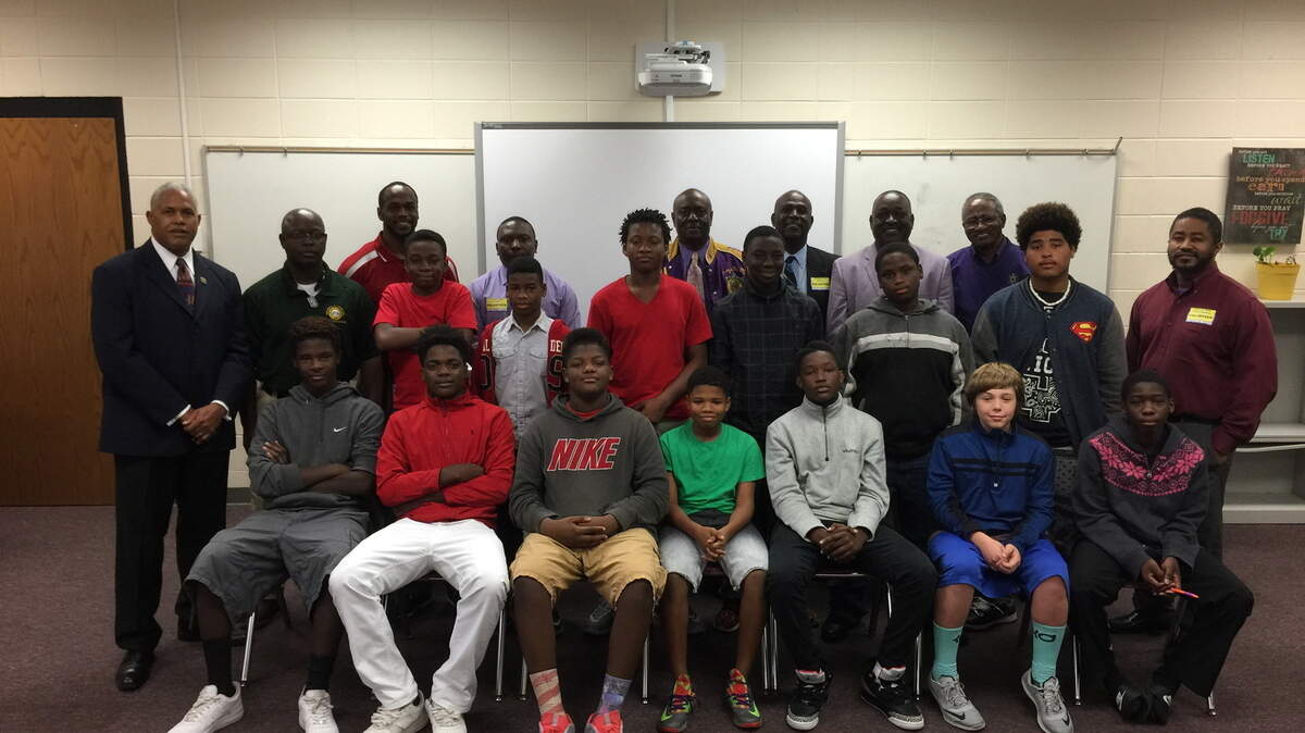 SPECIAL TO THE SUN NEWSMen from the Omega Psi Phi fraternity meet with students from Huntington Middle School once a week for mentoring.