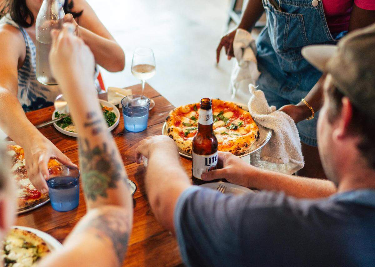 A new neighborhood pizza place opens in historic downtown Perry. This photo was taken at an earlier friends and family night.