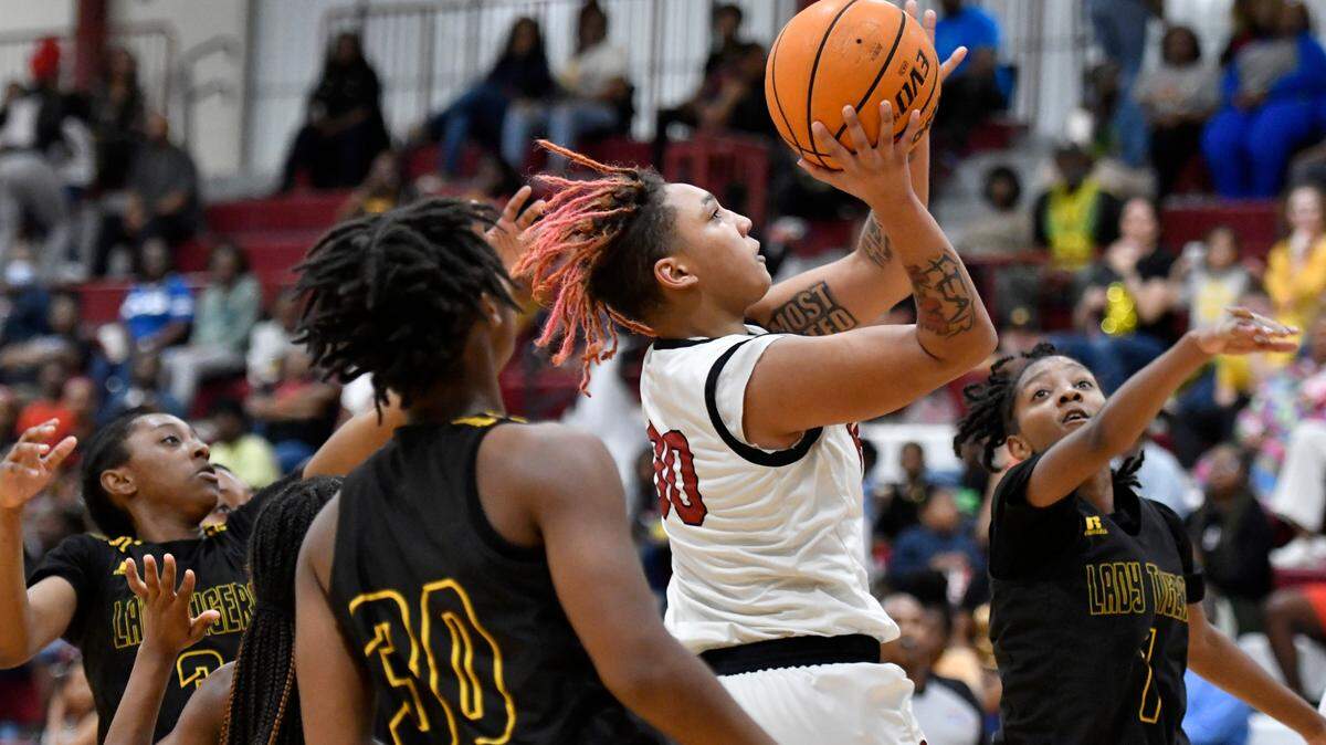 Warner Robins’ Jada Morgan (30) puts up a shot during the Demonettes GHSA second round playoff game against Harris County Friday night. Warner Robins advanced the to quarterfinals with a 55-43 win.