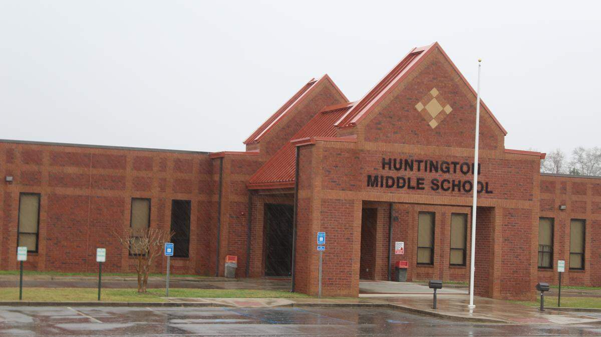 A 13-year-old girl was arrested and charged with making social media posts that threatened to "shoot up" Huntington Middle School.