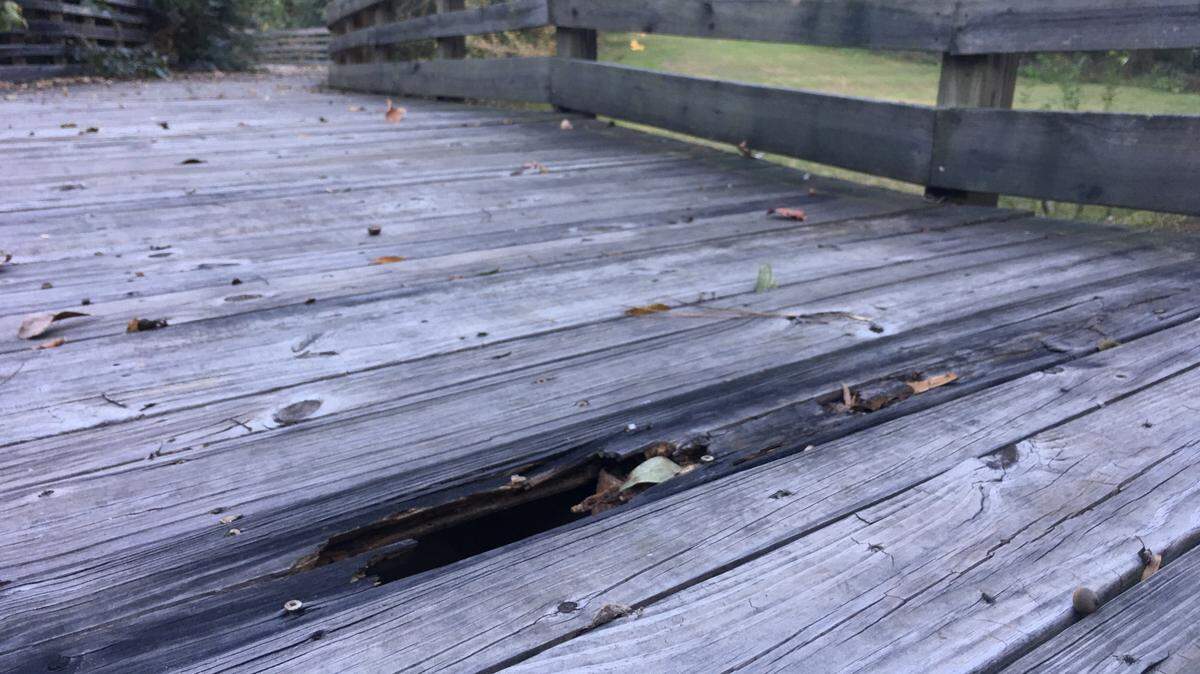 Part of the 7-year-old boardwalk has rotted at Riverside Cemetery but will be repaired while the new pedestrian bridge is built over the Vineville Branch.