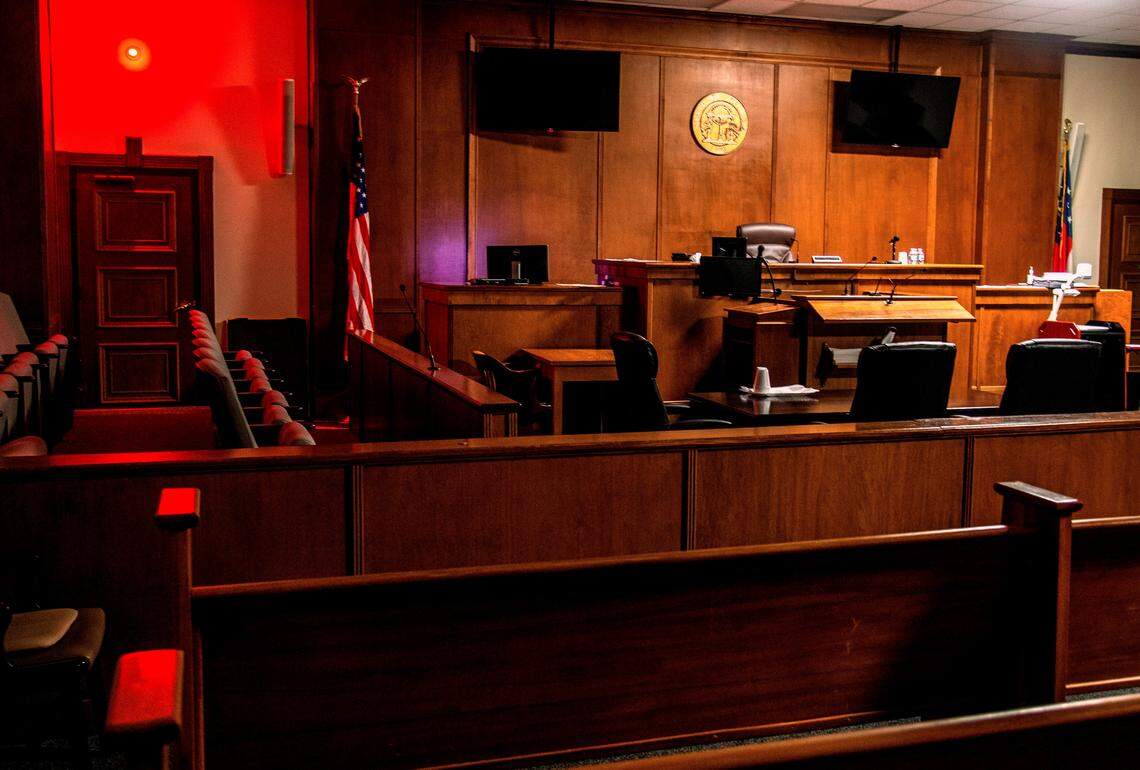Courtroom B at the Bibb County Courthouse, where Onterio KeShawn Smith went on trial in March to face child molestation charges. In this portrait of the empty courtroom, the red jury light, used to signal a verdict, is turned on for effect.