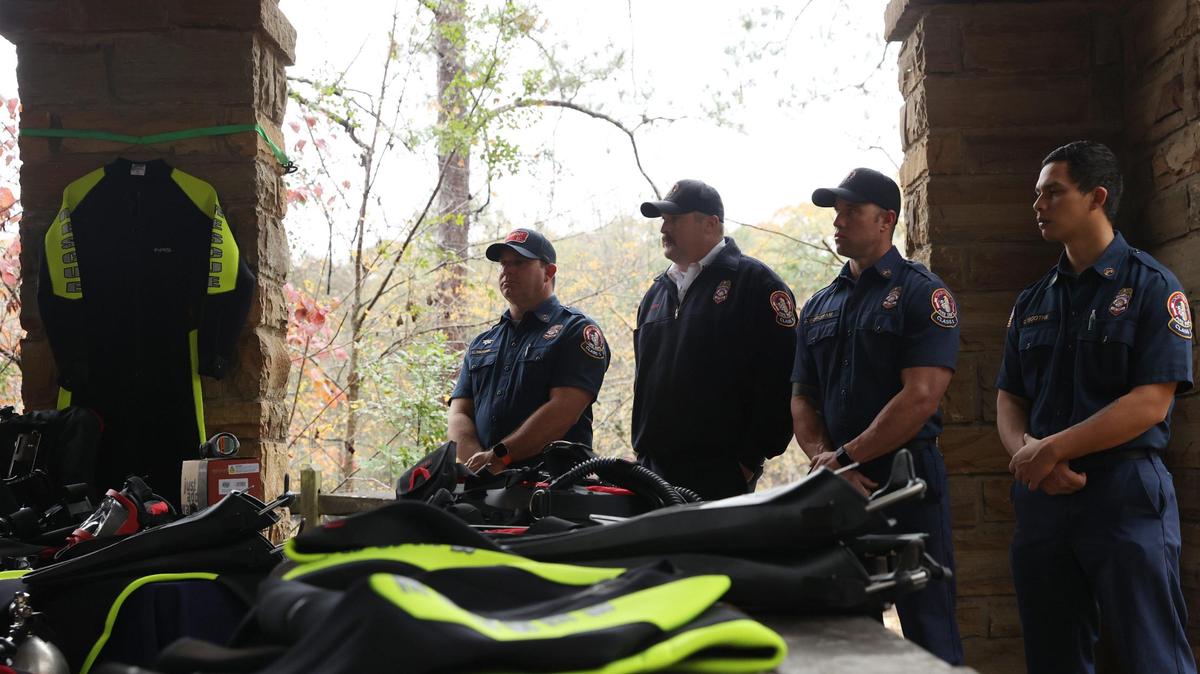 Members of the Macon-Bibb County Fire Department dive team stand near new scuba gear for the Bibb County Sheriff’s Office during a press conference on Tuesday, Dec. 10, 2024, at Amerson River Park in Macon, Georgia. The Bibb County Sheriff’s Office announced acquiring new scuba equipment that they will lend out to Macon-Bibb County Fire Department dive team to help in water emergencies. The money for the equipment was raised by the Macon-Bibb Law Enforcement Foundation.
