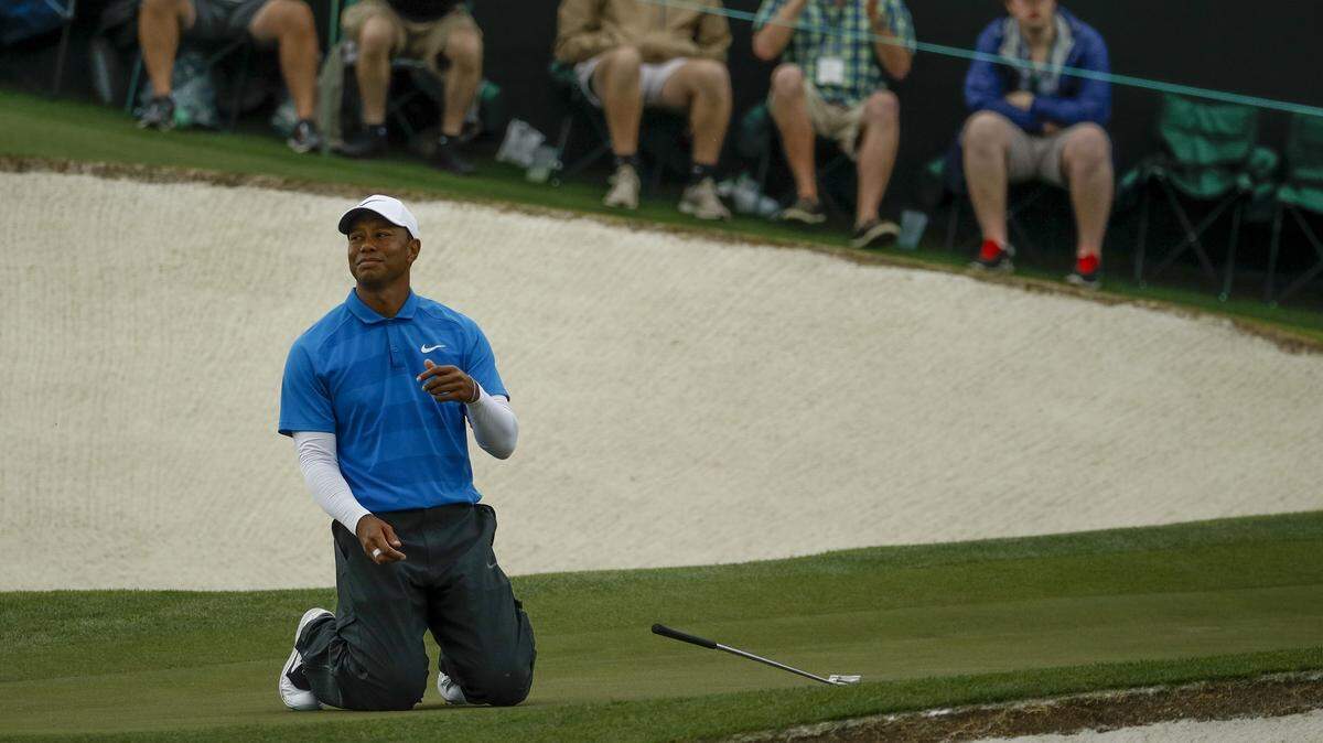 Tiger Woods reacts after missing a birdie on the 17th hole during the third round at the Masters golf tournament.