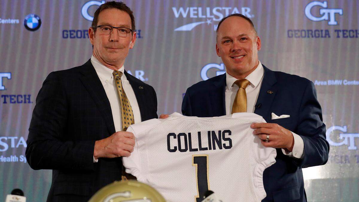 This Dec. 7, 2018, file photo shows newly hired Georgia Tech football coach Geoff Collins, right, and athletic director Todd Standsbury posing with a school jersey during a news conference in Atlanta. Georgia Tech on Tuesday, Feb. 26, 2019, announced plans to move five home games — one each in five consecutive seasons, including dates against Notre Dame in 2020 and 2024 — to Mercedes-Benz Stadium. The stadium, home to the NFL’s Atlanta Falcons and MLS’ Atlanta United, is less than one mile from the Georgia Tech campus.