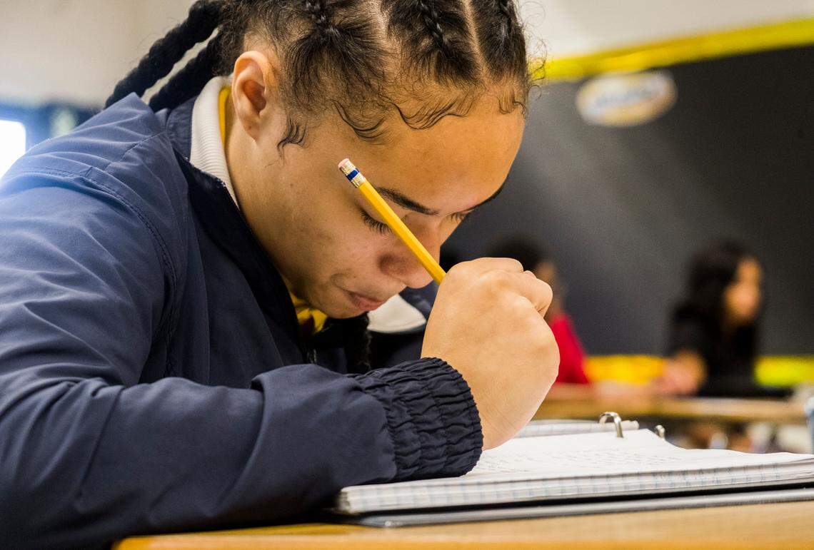 An Appling Middle School student writing during class.