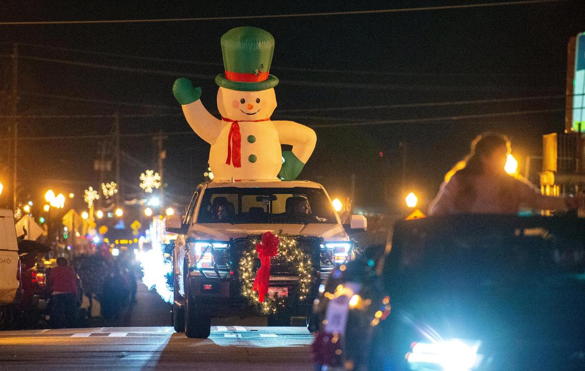 Frosty tops the hill on West Johnson Street during the Hometown Holidays Parade in downtown Forsyth Thursday evening. One of the few local Christmas parades that wasn’t canceled, the “spectacle of lights and music” lasted from 7-9 p.m.