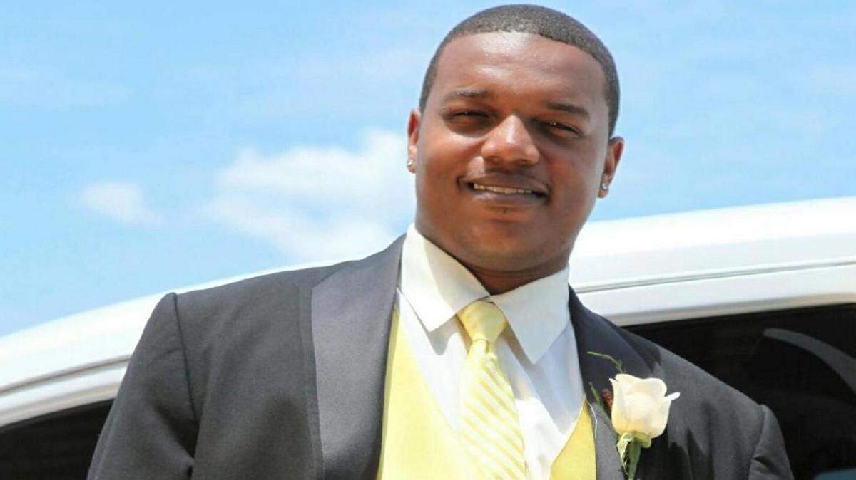 Brandon Harris served as a groomsmen in his father's wedding in 2012. The 29-year-old from Chicago was fatally shot Aug. 28 while visiting a friend in Macon.
