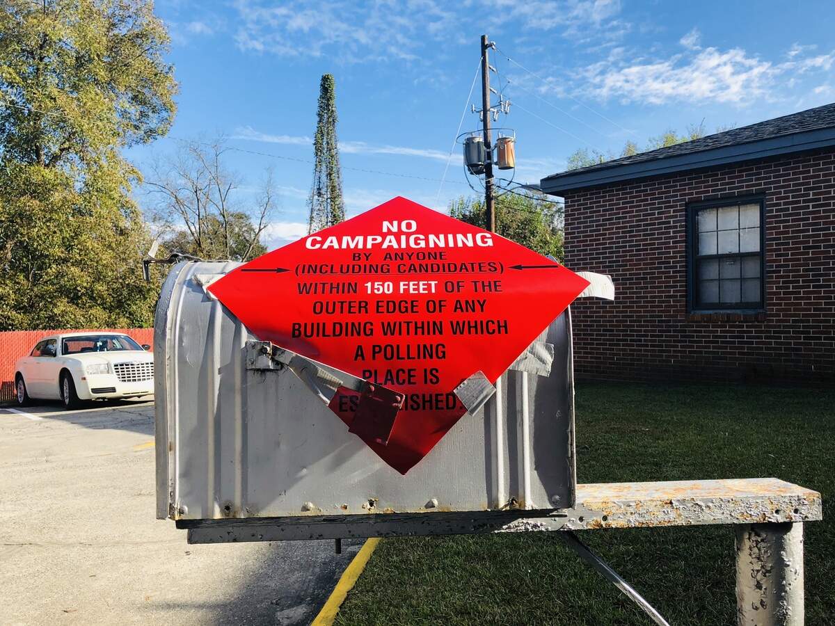 A warning outside the voting precinct at Glorious Hope Missionary Baptist Church on Napier Avenue.