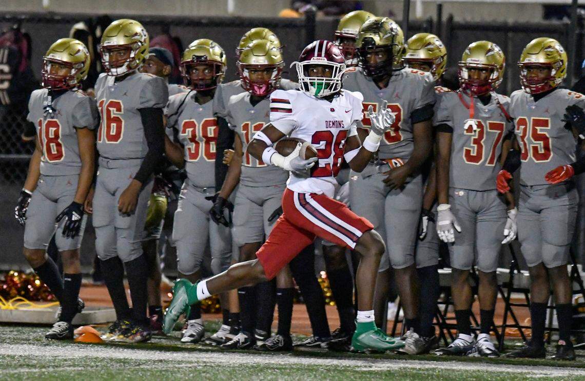 Warner Robins’ Myles Joyner (28) runs toward the end zone for a touchdown after intercepting a pass during the Demons’ 31-28 overtime win at Creekside Friday night.