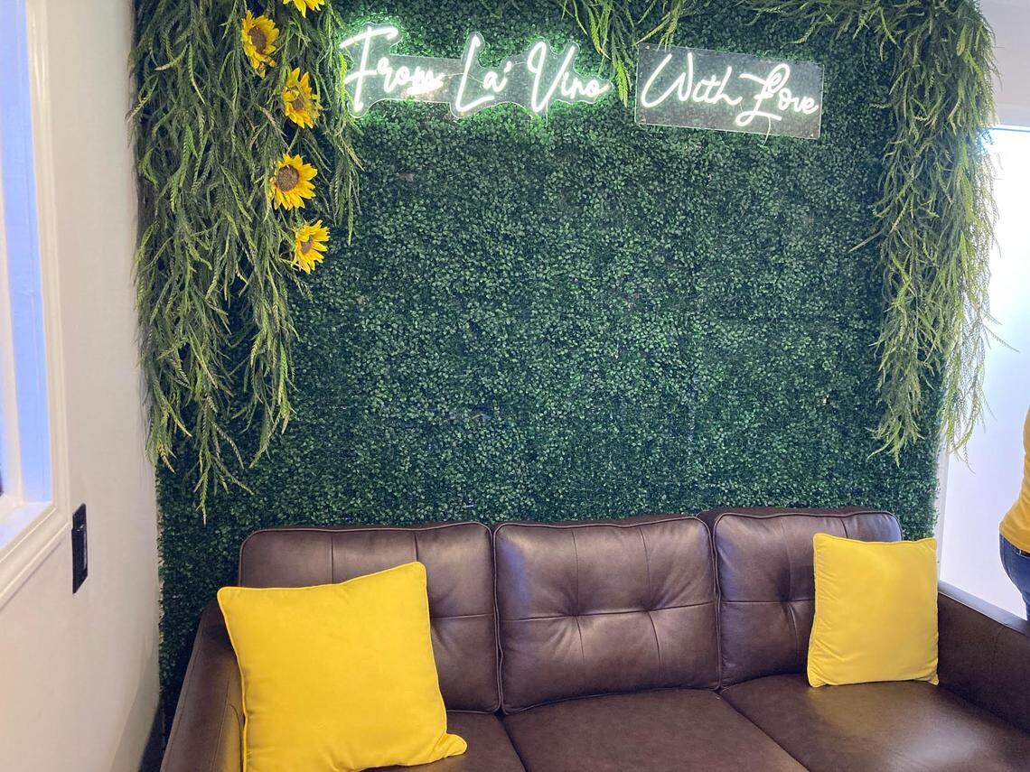 A room that can be used for wine tasting and private events at La’Vino Wine Bar in Warner Robins includes a space created for customers to take selfies if they desire.