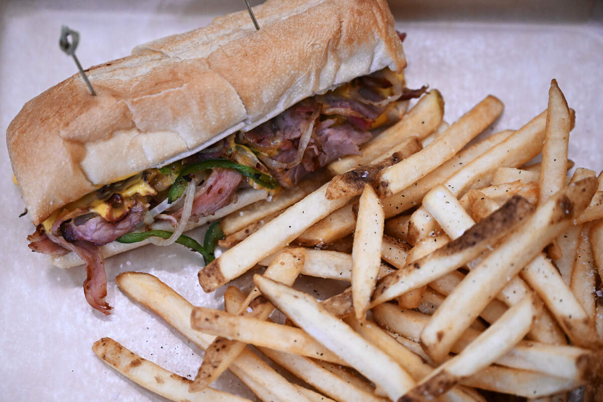 My Favorite Philly Cheesesteak from My Favorite Burger features slow cooked, sliced brisket with grilled onion, peppers and cheese sauce, plus an extra topping of grilled jalapeños, and served with fries.