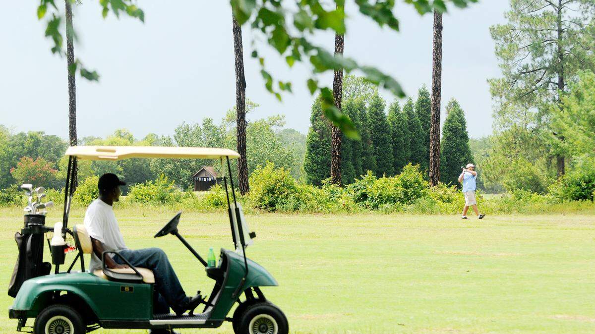 Golfers play at the city of Macon’s Bowden Golf Course.