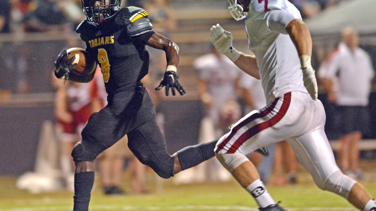 Peach County’s James Jackson crosses the goal line a step ahead of Warner Robins Connor Shaw.