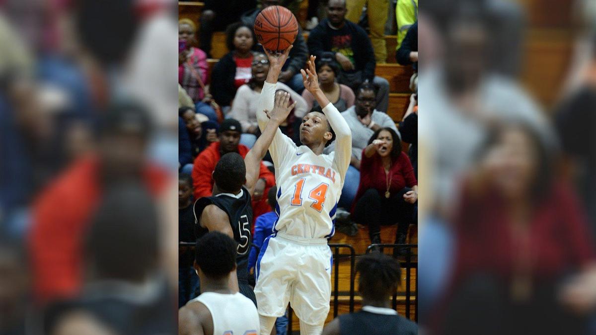 Central’s Antonio Card (14) pumps in one of his 3-pointers during overtime action.