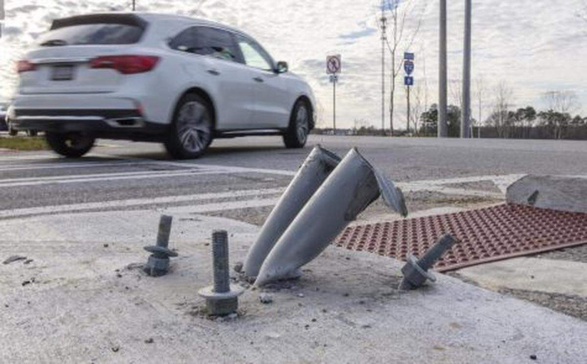 A vehicle apparently ran over the base for one of the pedestrian signal poles after it was recently installed at Bass Road and Interstate 75.