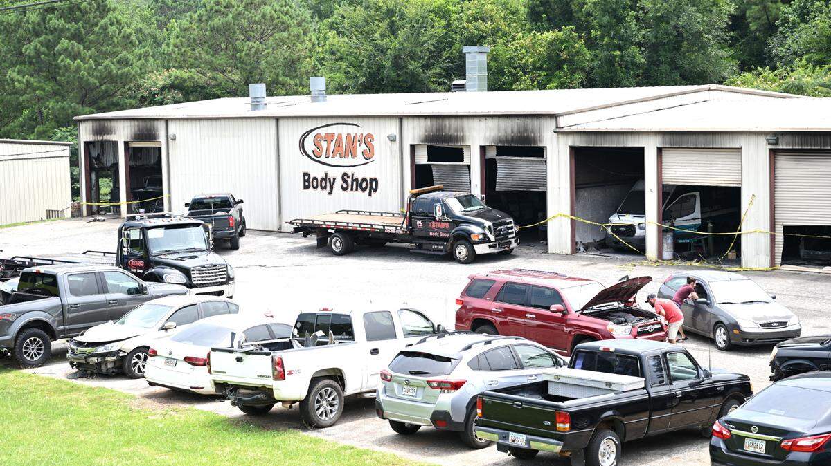 Garage entrances of a warehouse were covered in soot Monday, July 7, 2025, a day after a man allegedly started a fire at Stan’s Body Shop at 4250 Gray Highway in Gray, Ga.